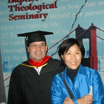 Chris graduating from Seminary in 2003, with Kim