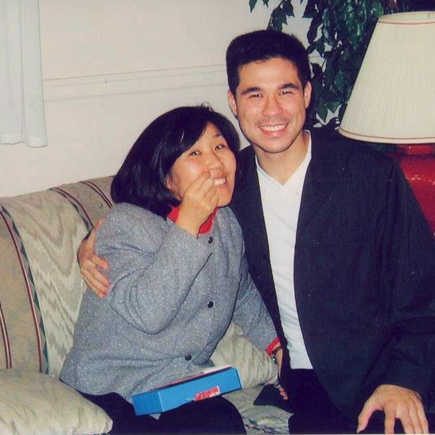 Simon with Kim holding his eyebrow ring in 2003
